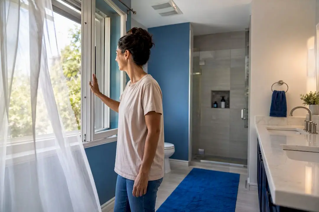 Open bathroom window providing ventilation